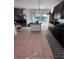 Well lit kitchen with an island, stainless steel appliances, dark cabinets, and a view into the yard at 14218 Squirrel Run, Orlando, FL 32828