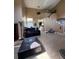 Open concept living room with soaring ceilings, tile flooring, and staircase at 14218 Squirrel Run, Orlando, FL 32828