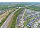 Overhead shot of the home and community, highlighting the landscape, water features, and proximity to the highway at 14384 Alafaya Oak Bnd, Orlando, FL 32828