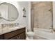 Bathroom features a vanity with granite countertop and a shower and tub combo at 14384 Alafaya Oak Bnd, Orlando, FL 32828