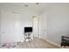 Spare bedroom featuring a glass table, closet and access to the hallway at 14384 Alafaya Oak Bnd, Orlando, FL 32828