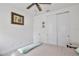 Carpeted bedroom features standard closet with sliding doors and ceiling fan at 14384 Alafaya Oak Bnd, Orlando, FL 32828