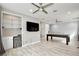 Bonus room with sleek wet bar featuring beverage fridge, open shelving, and a billiards table at 14384 Alafaya Oak Bnd, Orlando, FL 32828
