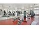 Community gym with modern equipment, fans, and large windows for ample natural light at 14384 Alafaya Oak Bnd, Orlando, FL 32828