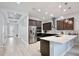 Bright kitchen boasts stainless steel appliances, a mosaic backsplash, and an open layout at 14384 Alafaya Oak Bnd, Orlando, FL 32828
