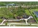 Community playground bordered by mature landscaping and a winding walking path at 14384 Alafaya Oak Bnd, Orlando, FL 32828