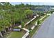 Rosedale community playground with palm trees and a walking path alongside well-manicured lawns at 14384 Alafaya Oak Bnd, Orlando, FL 32828