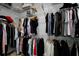 Walk-in closet featuring wire shelving with an array of colorful garments at 14384 Alafaya Oak Bnd, Orlando, FL 32828