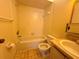 Full bathroom with tiled walls, shower and tub combination, toilet, and vanity at 15 Lake Villa Way, Kissimmee, FL 34743