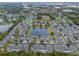 Picturesque aerial view of a residential community with a central pond and well-maintained landscaping at 1562 Travertine Ter, Sanford, FL 32771