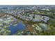 Aerial view of community with homes situated near ponds and natural wetlands at 1562 Travertine Ter, Sanford, FL 32771