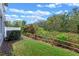 A view of the backyard featuring a well-maintained lawn and natural surroundings at 1562 Travertine Ter, Sanford, FL 32771