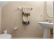 Half bathroom featuring modern fixtures and a pedestal sink at 1562 Travertine Ter, Sanford, FL 32771