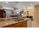 Gourmet kitchen with granite countertops, stainless appliances, and a breakfast bar at 1562 Travertine Ter, Sanford, FL 32771