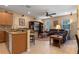 Open concept floor plan with a spacious seating area and bar top seating at 1562 Travertine Ter, Sanford, FL 32771