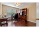 Office with hardwood floors and custom built-in shelves at 1562 Travertine Ter, Sanford, FL 32771