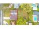 Birds-eye view of a home with a spacious backyard, showcasing its layout and surrounding neighborhood at 1612 Idaho Ave, Belle Isle, FL 32809