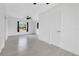 Bright bedroom featuring natural light, multiple entry doors, and grey tile floors at 1612 Idaho Ave, Belle Isle, FL 32809