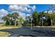 Modern playground featuring climbing structure and soft landing surface, surrounded by lush landscaping at 16328 Rock Coast Dr, Winter Garden, FL 34787