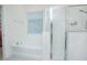 Clean and bright bathroom featuring a separate tub and shower with glass doors at 1636 Barberry Dr, Kissimmee, FL 34744