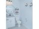 Powder room featuring modern fixtures and a decorative mirror at 1636 Barberry Dr, Kissimmee, FL 34744