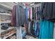 Walk-in closet with built-in shelving and ample storage space for clothes and shoes at 1636 Barberry Dr, Kissimmee, FL 34744