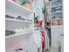 Walk-in closet with custom shelving and ample storage for clothes, shoes, and accessories at 1636 Barberry Dr, Kissimmee, FL 34744