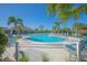 Large community pool with ample lounge seating, shaded areas, and a resort-like atmosphere for relaxation at 1636 Barberry Dr, Kissimmee, FL 34744