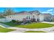 Beautiful home with a manicured lawn, stone accents, and a white picket fence in a peaceful neighborhood at 1636 Barberry Dr, Kissimmee, FL 34744