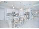 Modern kitchen with a large island, granite countertops, stainless steel appliances, and pendant lighting at 1636 Barberry Dr, Kissimmee, FL 34744