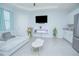 Cozy bonus room with contemporary furniture, neutral color palette, and a large window for natural light at 1636 Barberry Dr, Kissimmee, FL 34744