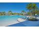 Community pool features a large pool, lounge chairs, and shade, ideal for enjoying the outdoors at 1636 Barberry Dr, Kissimmee, FL 34744
