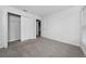 This bedroom features neutral carpet, white walls, and a closet with plenty of storage at 1760 Astrid Rd, Davenport, FL 33837