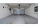 Spacious garage with white brick walls and plenty of room for parking and storage at 1760 Astrid Rd, Davenport, FL 33837
