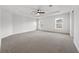Spacious main bedroom featuring tray ceiling, neutral carpet, and two windows for natural light at 1760 Astrid Rd, Davenport, FL 33837