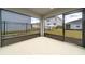 The screened patio offers views of the backyard and surrounding houses at 1760 Astrid Rd, Davenport, FL 33837