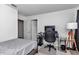Bedroom showing a bed, desk and chair at 1795 Nw 44Th Ct Rd, Ocala, FL 34482