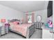 Bedroom featuring silver furnishings, bed, dresser, and a window with view of the outdoors at 1795 Nw 44Th Ct Rd, Ocala, FL 34482