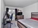 This bedroom features a bed, desk and chair for a cozy and productive space at 1795 Nw 44Th Ct Rd, Ocala, FL 34482