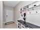 Welcoming foyer featuring coat rack with storage and white door entrance at 1795 Nw 44Th Ct Rd, Ocala, FL 34482