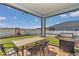 A screened patio features a dining table, chairs, and a grill at 1795 Nw 44Th Ct Rd, Ocala, FL 34482