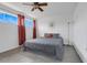 Bright bedroom with wood-look flooring, a ceiling fan, and a large window at 1838 Warringwood Dr # B-3, Orlando, FL 32839