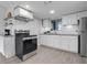 Well-equipped kitchen with stainless steel appliances, white cabinetry, and granite countertops at 1838 Warringwood Dr # B-3, Orlando, FL 32839