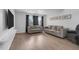 Bright living room with two sofas, neutral walls, and contemporary flooring at 1838 Warringwood Dr # B-3, Orlando, FL 32839