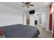 Bedroom with a ceiling fan and ensuite bathroom at 1838 Warringwood Dr # B-3, Orlando, FL 32839