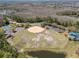 Aerial view of community baseball field and playground for residents at 2368 Buckingham Run Ct, Orlando, FL 32828