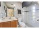 Bathroom with glass enclosed shower, wood cabinet vanity and neutral walls at 2368 Buckingham Run Ct, Orlando, FL 32828