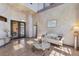 Inviting living room with tile floors, sophisticated decor, and views of the pool area at 2368 Buckingham Run Ct, Orlando, FL 32828