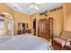 Main bedroom featuring an ensuite bath, wood flooring, and a spacious closet at 2368 Buckingham Run Ct, Orlando, FL 32828