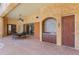 Covered outdoor patio with dining set and built-in kitchen space at 2368 Buckingham Run Ct, Orlando, FL 32828